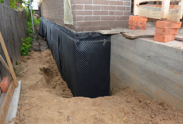 Happy homeowners after waterproofing job in Muskegon